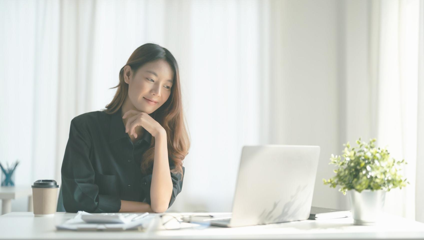 Person working late on financial planning documents
